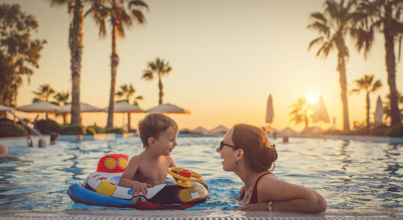 Woman in pool with toddler