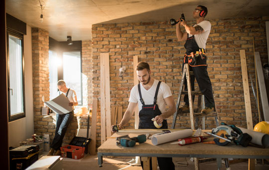 Construction workers designing home interior