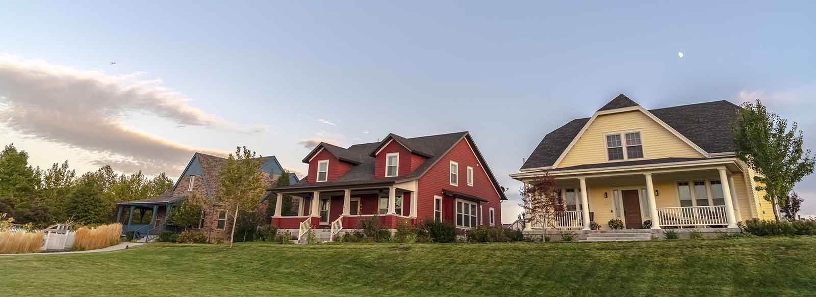 The exterior of three homes