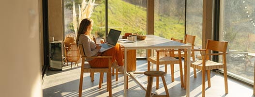 Person on laptop in kitchen