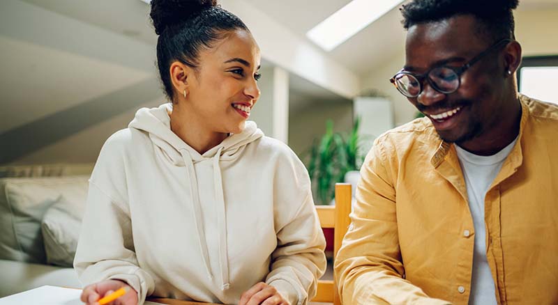 Couple smiling at home