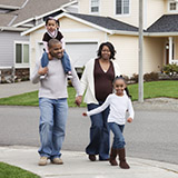 Family walking through neighborhood