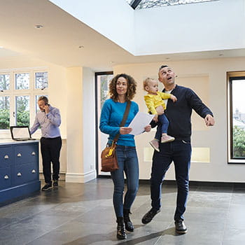 Family looking inside a home for sale