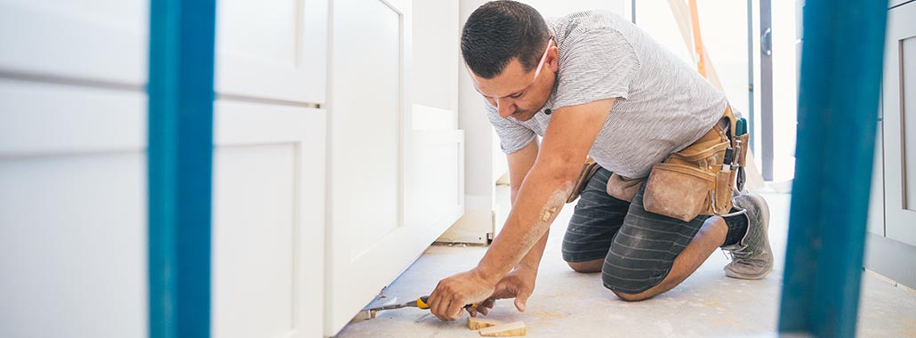 Person making home repairs