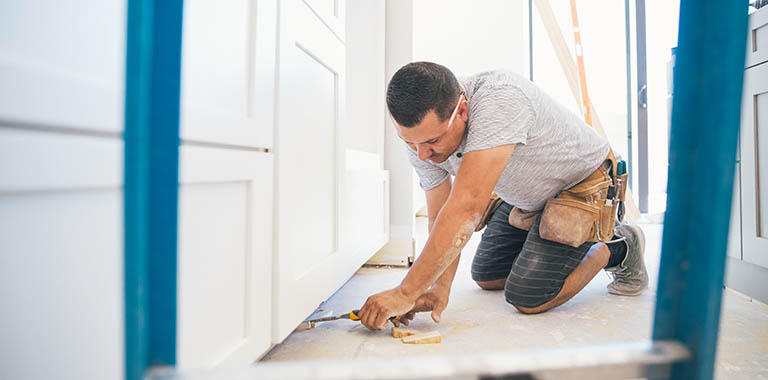 Person making home repairs