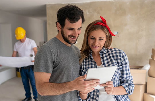 A couple reviews home improvement plans together