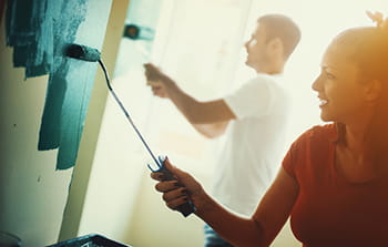 Couple painting and remodeling their home