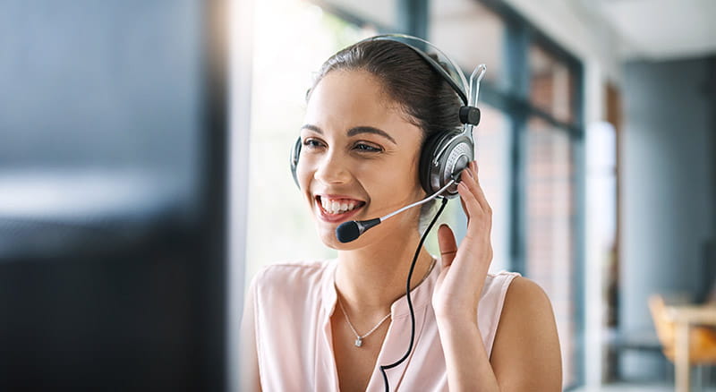 Loan by phone employee on the phone at computer