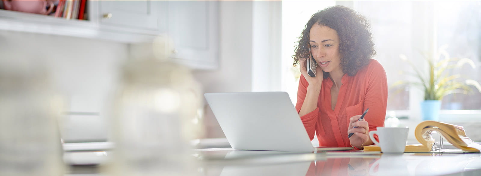 Woman on the phone at her computer