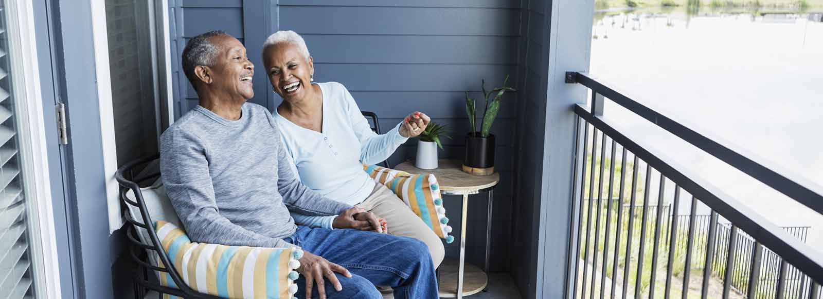 Couple sitting on porch smiling