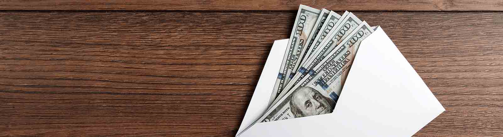 envelope with $100 bills