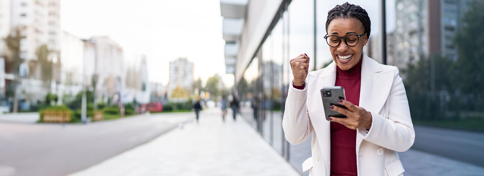 Excited person looking at a cellphone