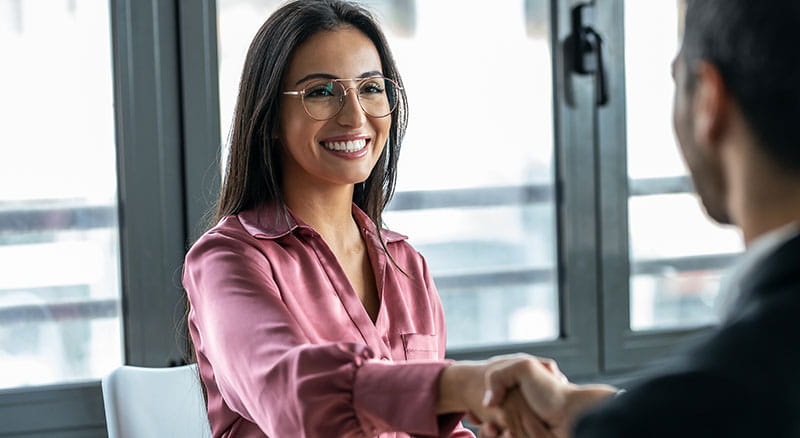Banker shakes hands with customer