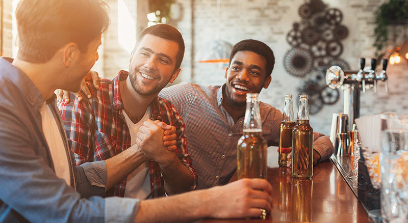 Three friends meet at a microbrewery