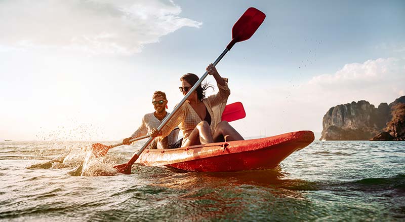 Couple kayaking on a sunny day
