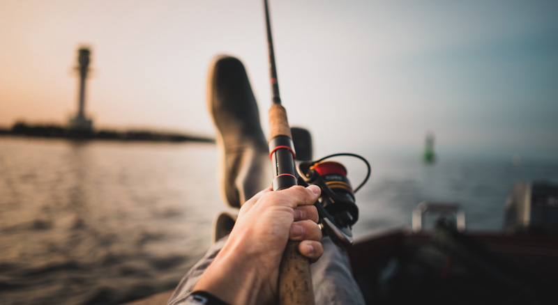 Man fishing from dock