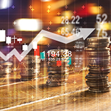 Stacks of quarters progressively taller with a line arrow graph and stock market numbers faded in the background