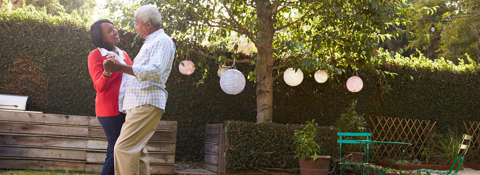 Couple dancing together outside in the backyard