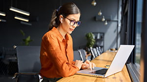 Person at a laptop in an office 