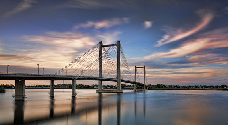 Kennewick bridge over water at sunset