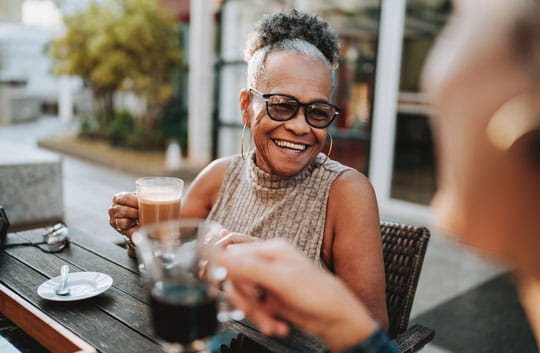 Older woman having coffee with a friend